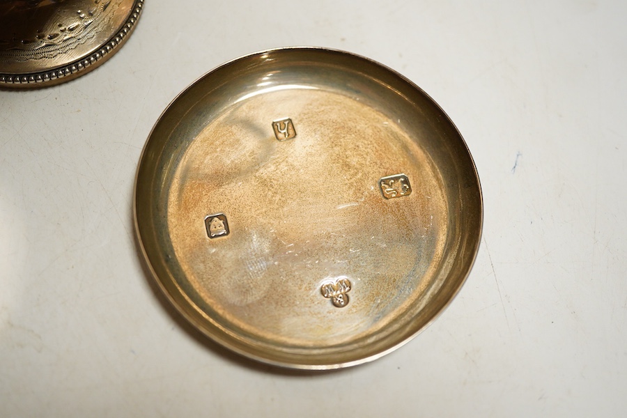 A Victorian silver cream jug, London, 1874, Robert Harper, of helmet form with bright cut decoration, together with a small continental beaker and an Elizabeth II pin dish with feature hallmarks, weight approx 8.56ozt (3